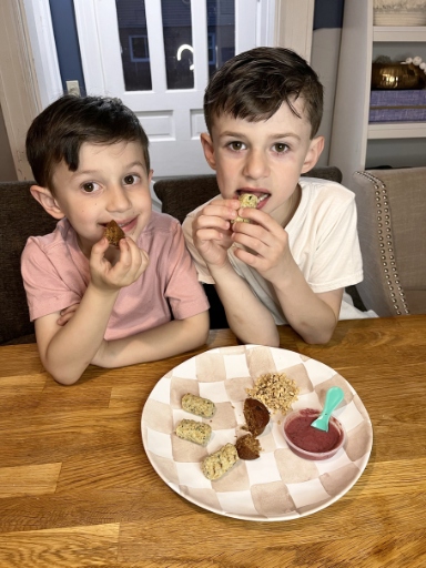 kids eating little spoon chicken maple sausage meal